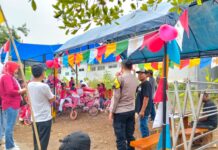 Bhabinkamtibmas Amankan Pawai dan Lomba Sepeda Hias Meriahkan HUT ke-81 Kemerdekaan RI di Desa Sidaraja