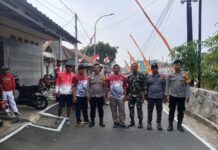 Sinergitas TNI-Polri Anggota Polsek Ciawigebang dan Koramil Ciawigebang Amankan Gerak Jalan Santai HUT ke-81 Kemerdekaan RI di Desa Ciputat