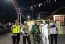 Jaga Kelancaran Kegiatan Keagamaan, Bhabinkamtibmas dan Babinsa Desa Sidaraja Kawal Pawai Ta’aruf Maulid Nabi Muhammad SAW 1448 H