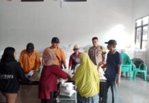 Bhabinkamtibmas Desa Sidaraja Amankan Penyaluran Bantuan Pangan Beras untuk 1.024 KPM