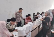 Bhabinkamtibmas Desa Sidaraja Monitoring Penyaluran Bantuan Pangan Beras untuk 1.024 KPM