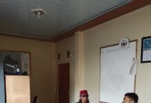 Cegah Karhutla Sejak Dini, Bhabinkamtibmas Desa Sidaraja Lakukan Koordinasi dengan Perangkat Desa